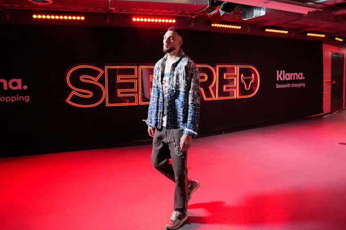 Chicago Bulls guard Zach LaVine (8) walks into the United Center before a game against the Charlotte Hornets. 